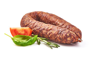 Air dried pork sausage ring and German Bierbeißer, smoked meat, close-up, isolated on white background