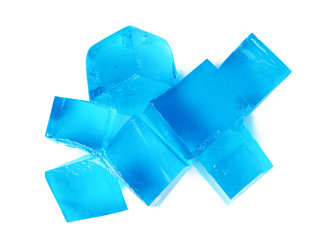 Heap of blue jelly cubes on white background, top view