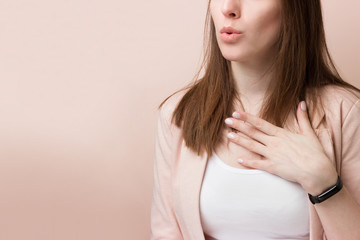 Obraz premium Portrait of a young excited cute girl on a pink background