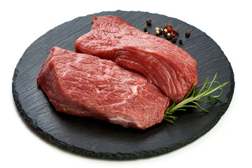 Raw beef for grill, BBQ or cooking, sliced fresh meat, close-up, isolated on white background
