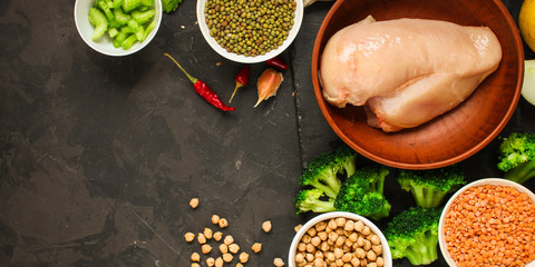 raw chicken meat, vegetables and legumes (lentils, vasol, chickpeas, and more) and a set of ingredients, healthy food - superfood. copy space. food background. top