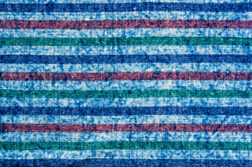 Obraz premium Blue washed faded jeans striped texture with seams