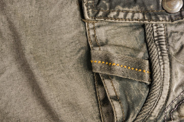 clothing items washed cotton fabric texture with seams, clasps, buttons and rivets
