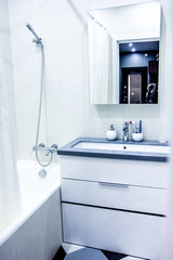 Modern house interior white bathroom decor elements and luxury furnishing segments of an empty apartment with washing machine