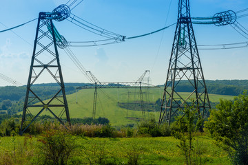 power line close up against the blue sky. Power industry