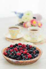 Summer berry pie with tea