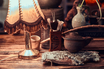 Ancient Chinese Medicine. Close-up view of a wooden table with various accessories 