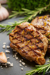 Grilled beef steaks with spices.