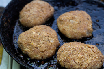 Preparing of cutlet from minced meat in frying pan
