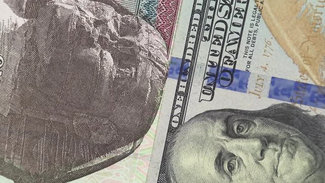 Egypt pound against US dollar bill rotating. Egypt and USA trade. 4K stock video footage