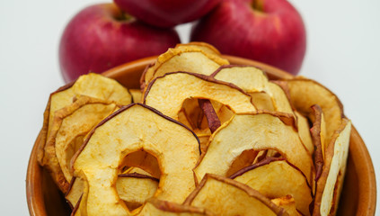 Apple chips in a ceramic bowl