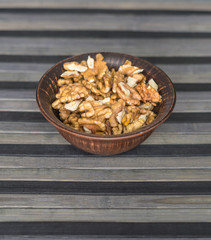 Healthy food  for background image close up walnuts.  Nuts  texture on top view on the cup plate