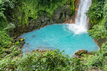 Naklejka na ściany i meble scenic waterfall in tenorio volcano national park