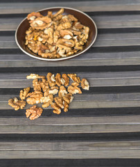 Healthy food  for background image close up walnuts.  Nuts  texture on top view on the cup plate