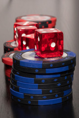 Rolling Casino Dice in a casino, Poker Chips