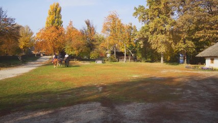 Tourists Riding Horseback at Educational Cultural Vilage in Ukraine