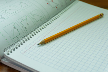 Notebook and pencil.