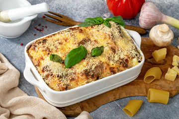 Cannelloni with ham and mushrooms on table