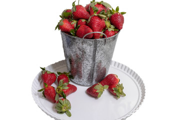 strawberries in a bucket isolated on white