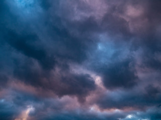 Naklejka na ściany i meble Sunset sky and rainy colourfull clouds