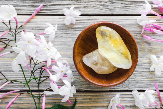 Teak Bowl of Citrine with Jasmine on White Washed Wood