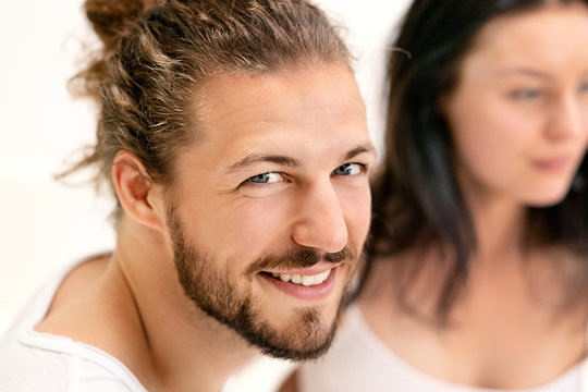 Affectionate couple , man looking at camera, smiling