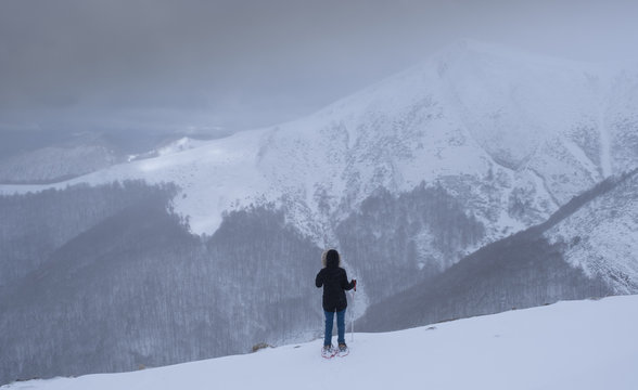 Lonely woman facing a challenge in the mountains, Pyrenees, Navarra