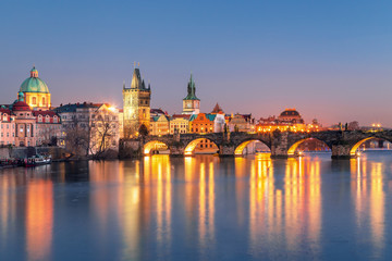 Fototapeta na wymiar Scenic view Charles bridge and historical center of Prague, buildings and landmarks of old town at sunset, Prague, Czech Republic