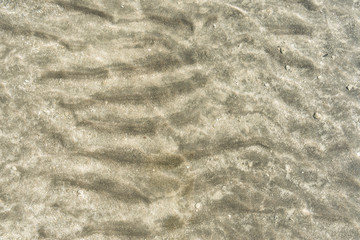 Fototapeta na wymiar Transparent water surface and sand on the lake bottom
