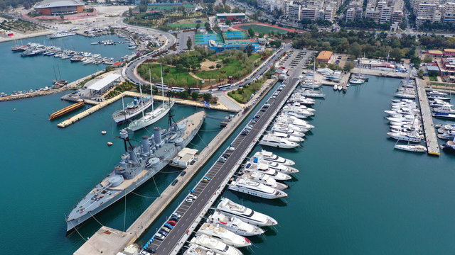 Aerial drone bird's eye view of small port and Park of Maritime Tradition where historic Averof warship is docked, Flisvos, Faliro Marina, Athens riviera, Attica, Greece