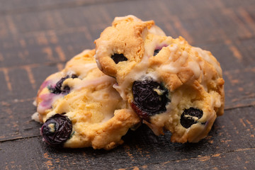 Two Lemon and Blueberries Scones on a Wooden Table