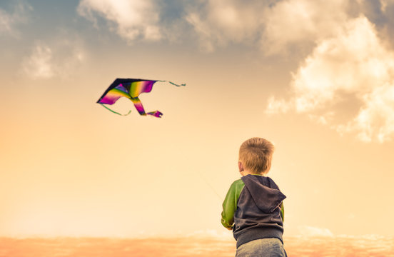 Little Boy Flying A Kite