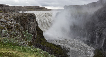 Waterfall Dettifoss is one of the most powerful and most sullen