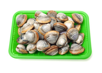 Stacked fresh raw clams on white background