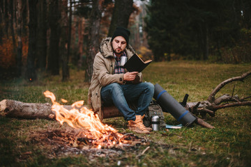 Young blogger photographer travel in mountain forest