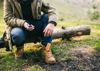 Young blogger photographer travel in mountain forest