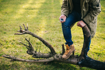 Young blogger photographer travel in mountain forest