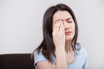 Young woman with eye fatigue