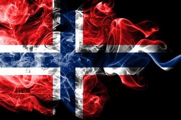 National flag of Norway made from colored smoke isolated on black background. Abstract silky wave background.