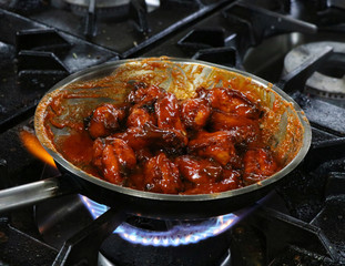 buffalo chicken wings in a cooking pan