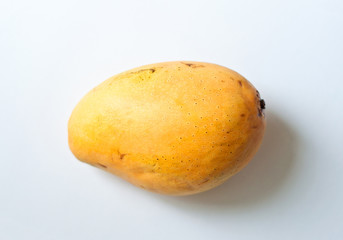 Ripe yellow mango on white background