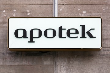 Pharmacy sign on a wall called apotek in Danish language