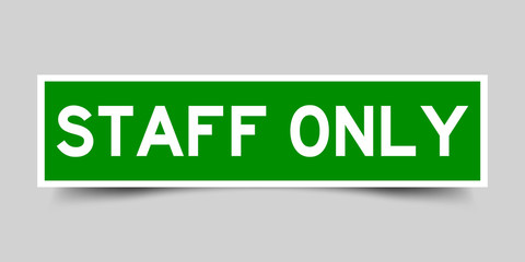 Square green sticker label in word staff only on gray background