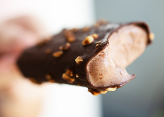 People eating chocolate-coated popsicle
