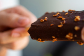 People eating chocolate-coated popsicle