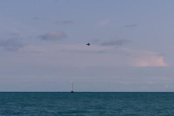 JET PLANE AND BOATS ON SEA