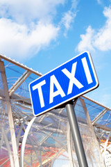 Fototapeta premium Taxi sign with blue sky and clouds 2
