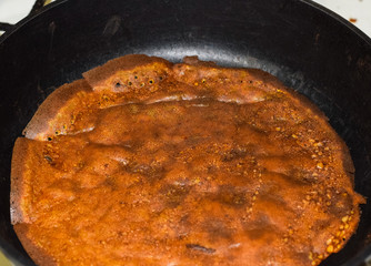 Frying pancakes on rye flour without butter in a pan with non stick coating