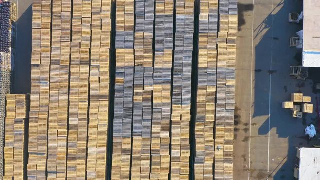 Aerial view of the outside storage of wooden pallets on the logistics park territory