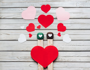 Two big matches and love sododets on a wooden background. Valentine's Day, February 14, March 8. Love and accordion, gift and recognition. Concept and photography.